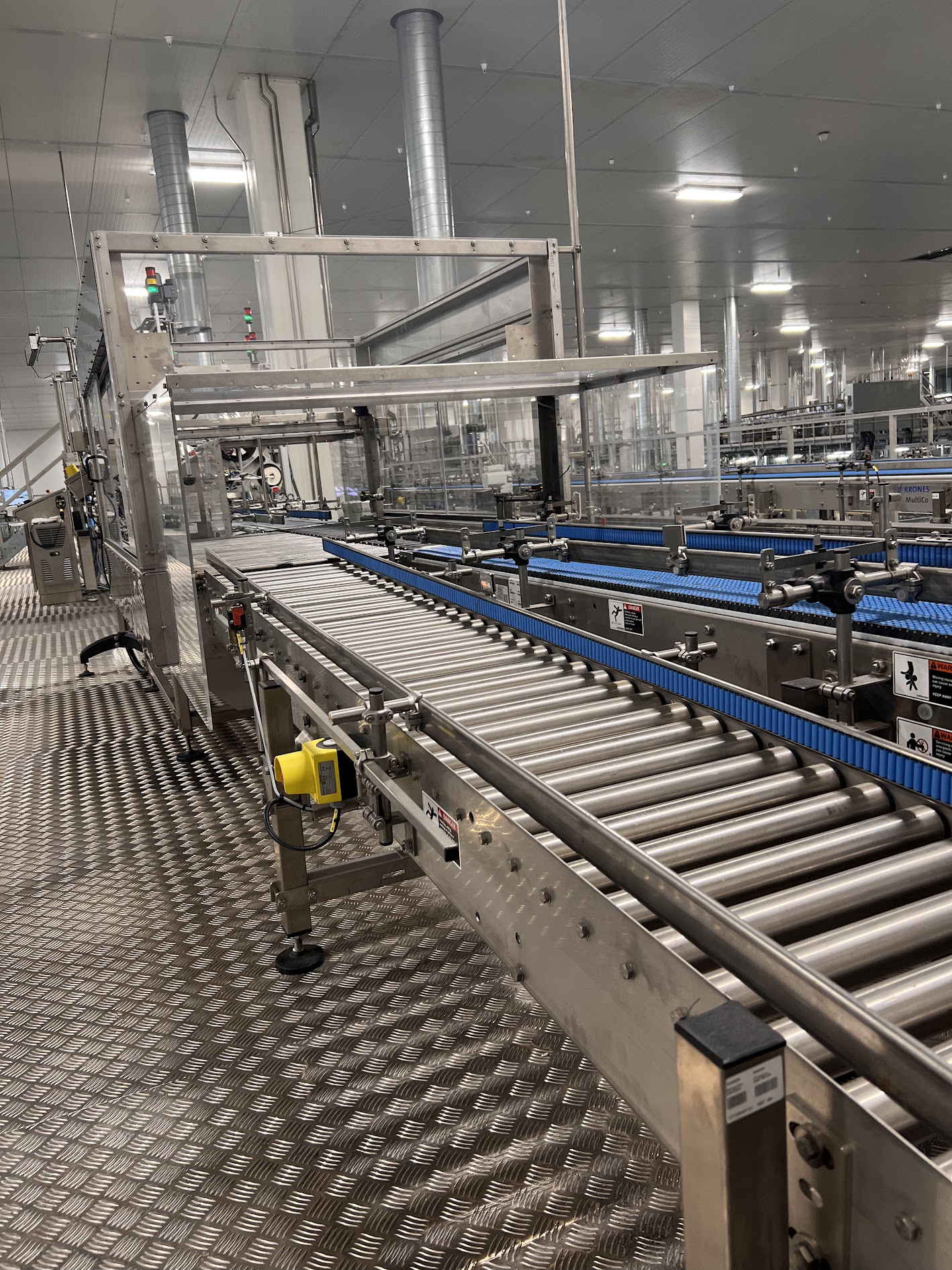 Stainless steel roller conveyor and blue belt conveyor installation